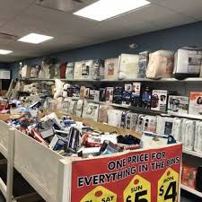 Interior of Jax Bargain Center bin store in Jacksonville with shoppers browsing discounted liquidation bins, Bin Stores In Florida